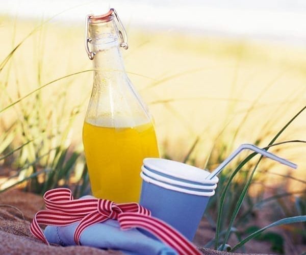 Homemade orangeade in a glass bottle