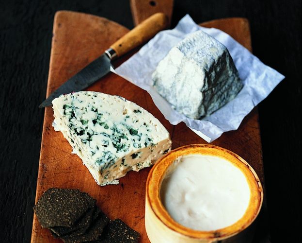 A French cheeseboard - cheeses on a wooden board