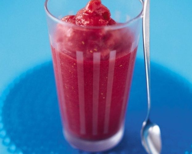 Raspberry and peach smoothie in a glass