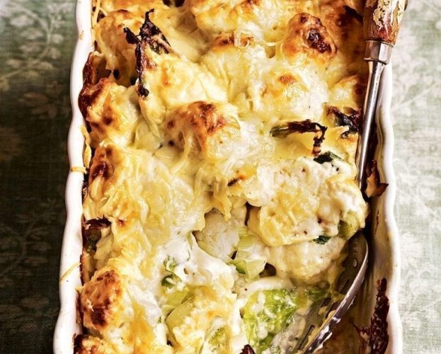 Cauliflower cheese gratin in a white baking tray