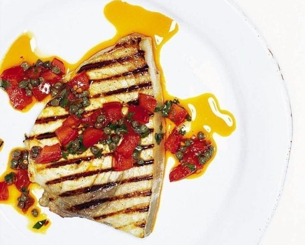 Fresh tuna steaks with a tomato and caper sauce
