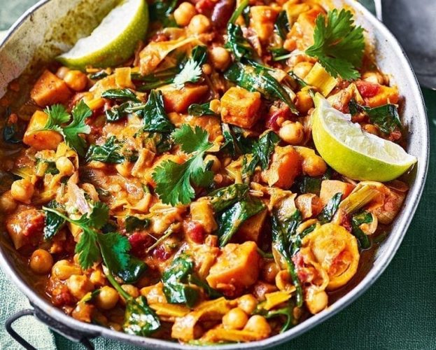 Sweet potato and chickpea curry shown in a pan