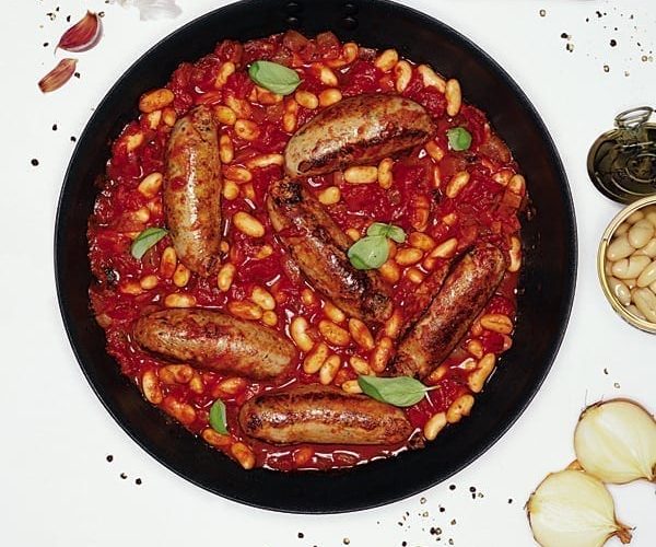 Sausages in tomato sauce with cannellini beans