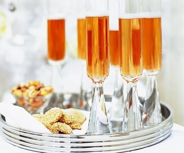 A tray containing cocktails and a pile of stilton biscuits
