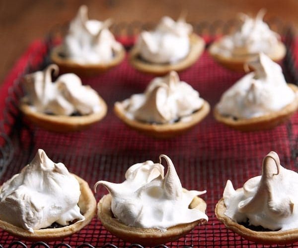 Meringue-topped mince pies in a tin