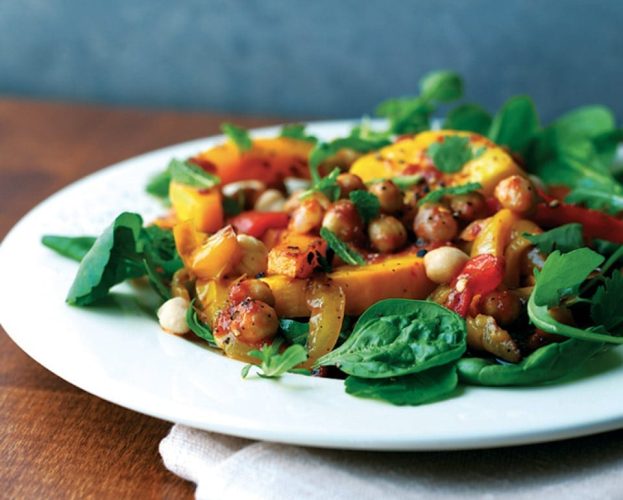 Colourful roast squash salad shown on a white plate