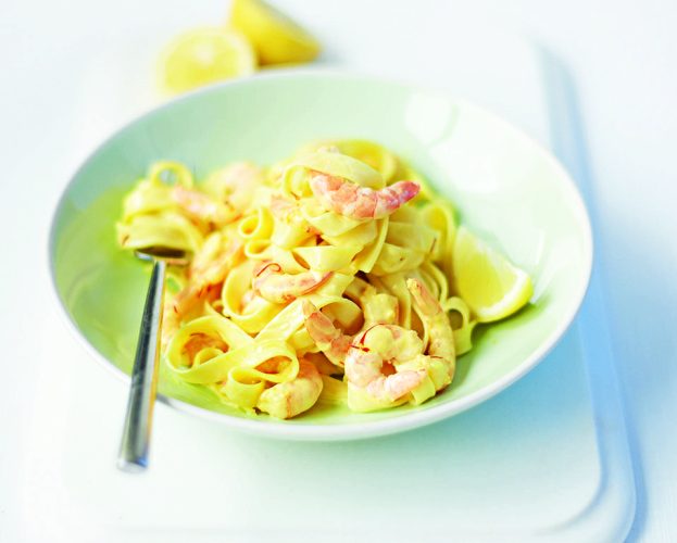 Saffron and prawn pasta shown in a bowl