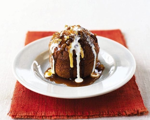 Individual stem ginger pudding shown on a white plate