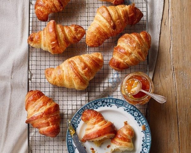 Croissants cooling on a wire rack