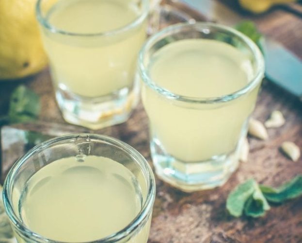 Homemade limoncello in glasses