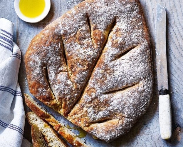 A baked Fougasse loaf, which resembles a leaf shape with veins cut in