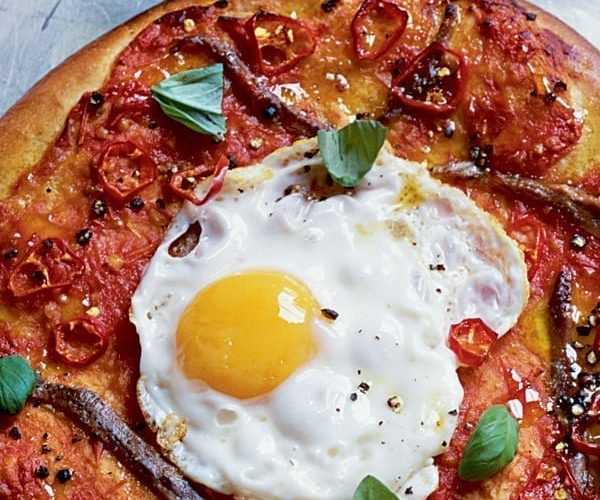 A fried egg on a pizza