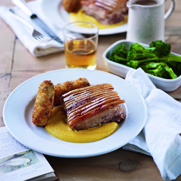 Pork belly with wild garlic croquettes, root veg purée and cider