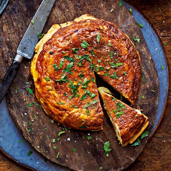 Spanish tortilla sprinkled with herbs