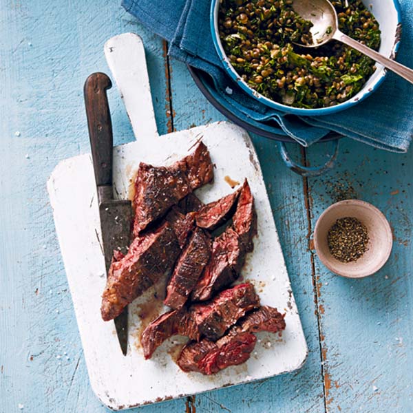 Onglet beef steak shown sliced on a chopping board