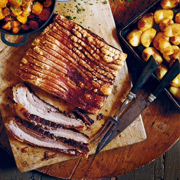 Slow roasted pork with crackling, roast apples and cider gravy