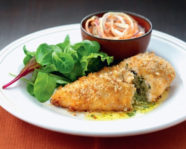 Chicken kiev with a coleslaw salad image