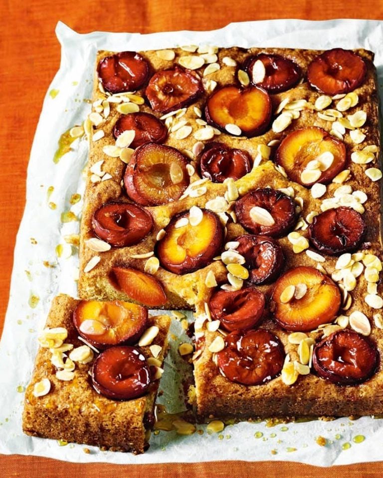 Plum cake with custard, shown on baking paper