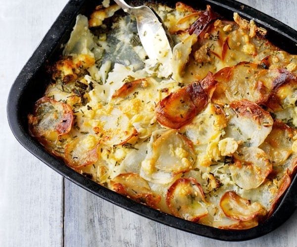 Potato, cheese and onion gratin in a pan
