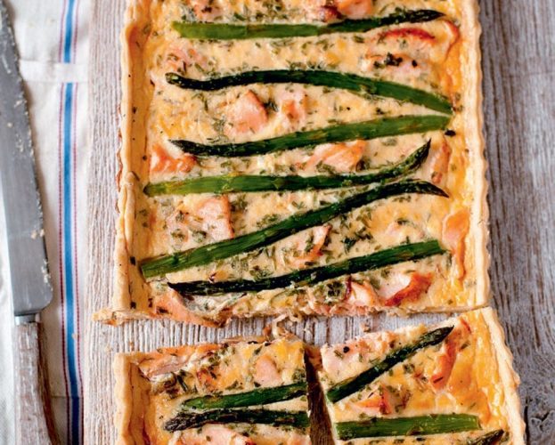 salmon asparagus tart shown on a chopping board