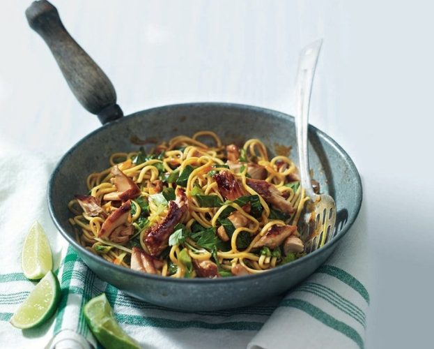 Teriyaki salmon noodles in a wok