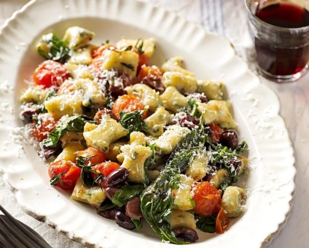 Spinach gnocchi with blistered tomatoes, basil and olives