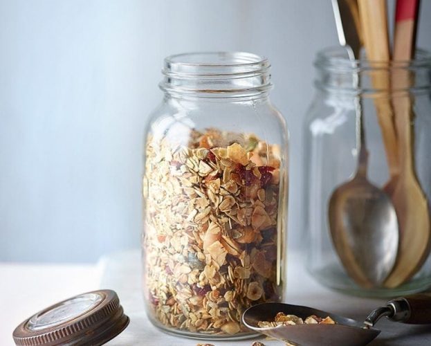 Low-sugar granola in a glass jar