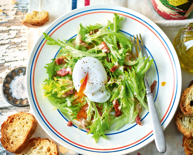 Image of french salad topped with poached egg