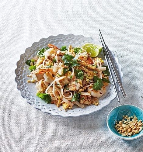 Pad Thai noodles in a white bowl