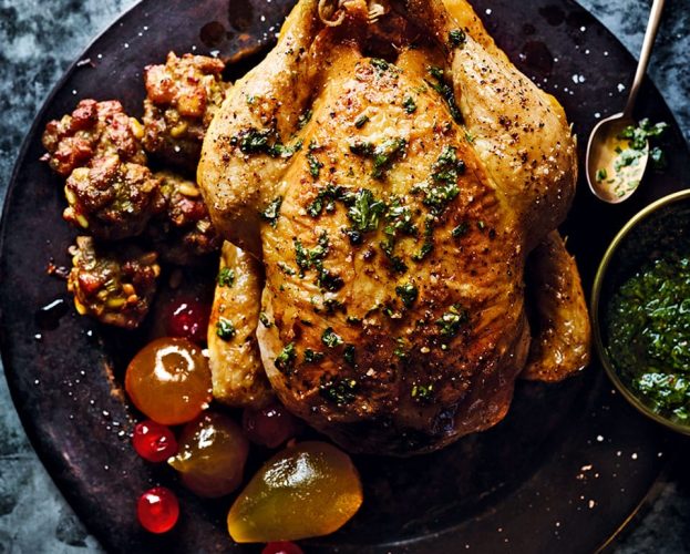 Roast stuffed chicken with mustard fruits and green sauce