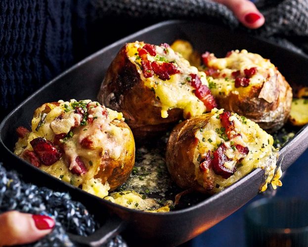 Baked potatoes stuffed with bacon, cheese and chives