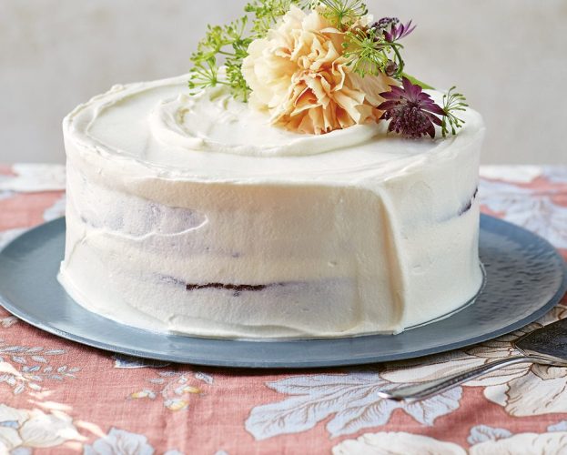 Manon Lagreve's carrot cake shown with a floral decoration