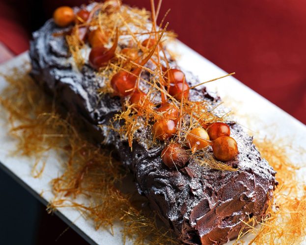 A Yule log topped with caramelised nuts