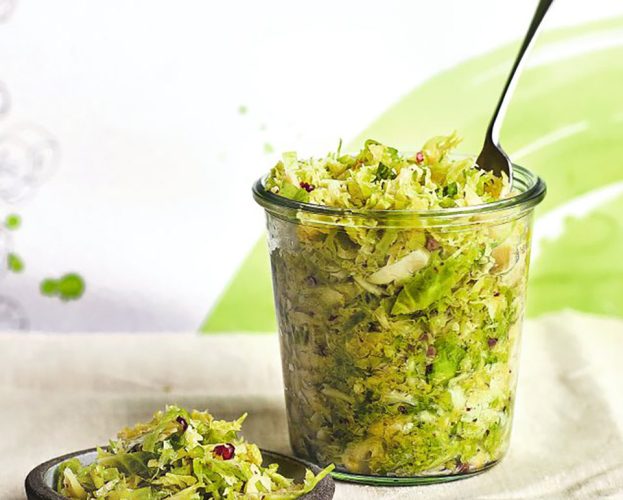 A open jar of brussels sprout sauerkraut