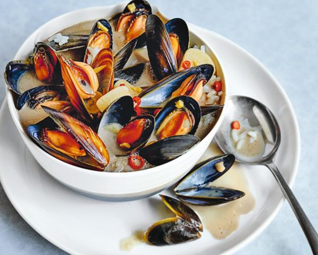 A bowl of mussels in coconut broth