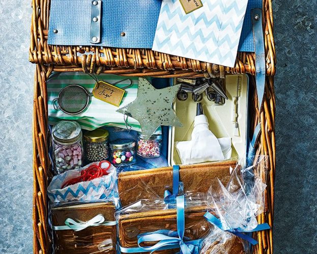 Wicker hamper containing components to make a gingerbread house