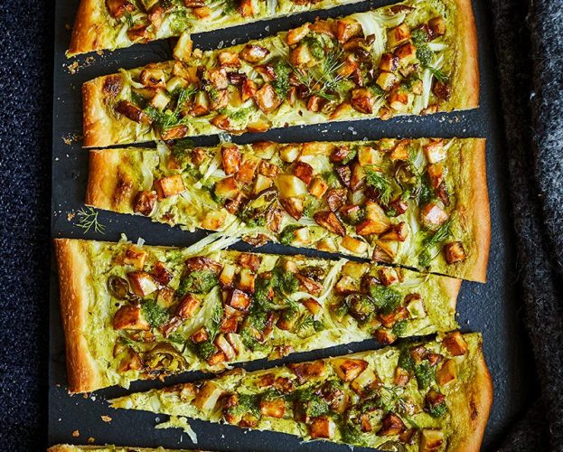 A potato-topped pizza, sliced into strips