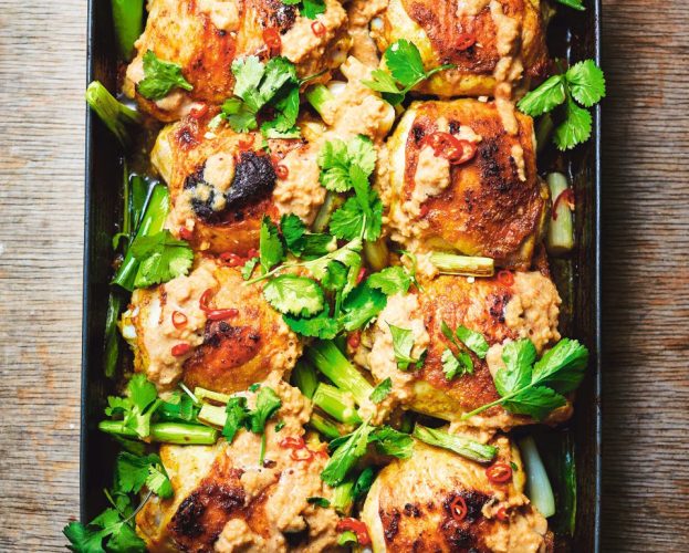 A roasting tray with chicken in peanut sauce