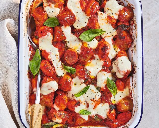 Sausage with gnocchi bake, with mozzarella and basil leaves on top