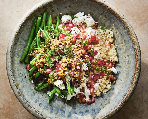 Green beans, bulgur, feta and pomegranate with sunflower seed dressing