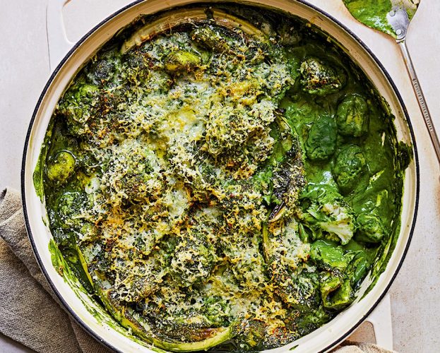 Green cauliflower cheese gnocchi in a large white casserole dish