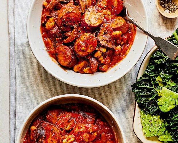Smoked sausage, mushroom and bean stew in two white bowls