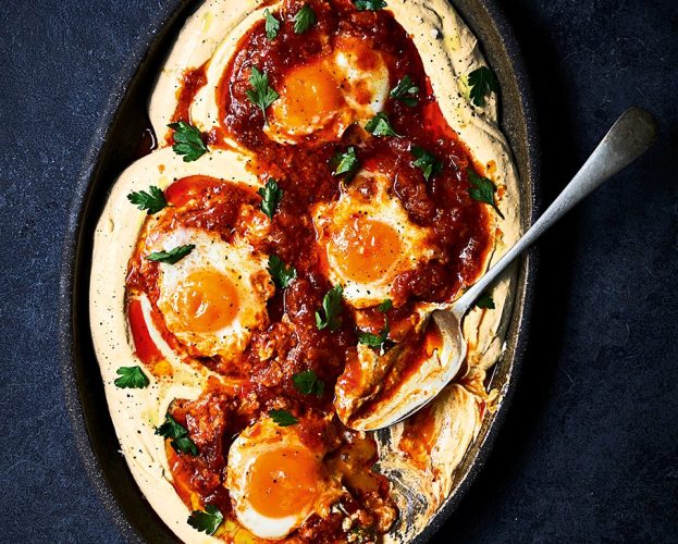 Houmous with tomato and mango chutney- braised eggs on a platter
