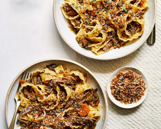 Two bowls of herby venison shank ragù with pappardelle pasta