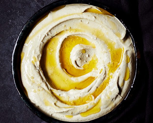 A bowl of houmous drizzled with olive oil