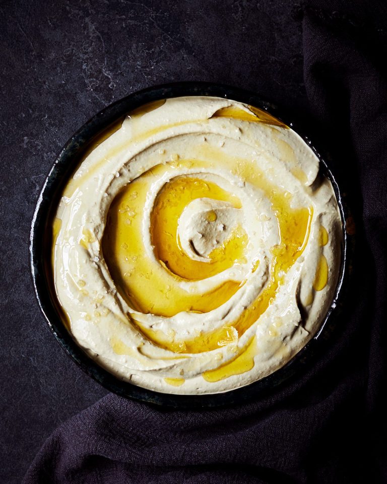 A bowl of houmous drizzled with olive oil
