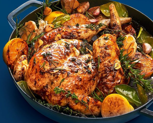A roast chicken in a tray
