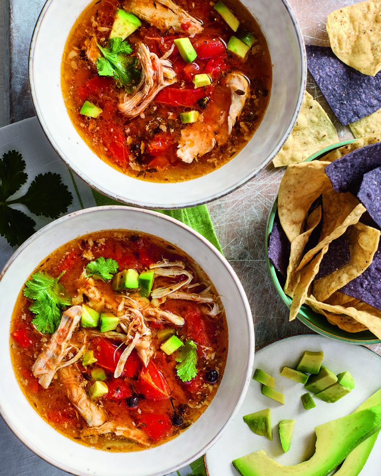 Slow cooker citrus chicken broth with tortillas and avocado