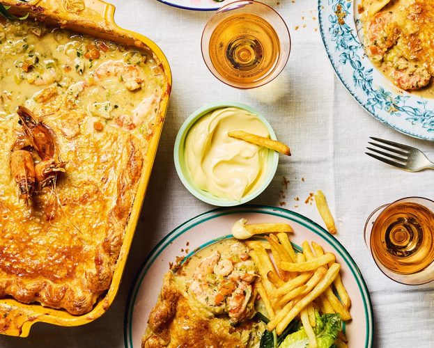 Crab and prawn pot pies with chips and salad