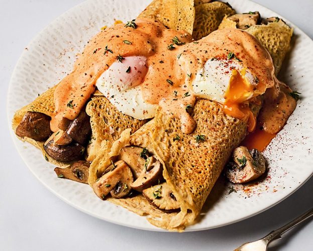 Mushroom buckwheat pancakes with poached egg and paprika hollandaise